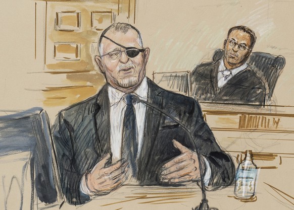 FILE - This artist sketch depicts the trial of Oath Keepers leader Stewart Rhodes, left, as he testifies before U.S. District Judge Amit Mehta on charges of seditious conspiracy in the Jan. 6, 2021, a ...