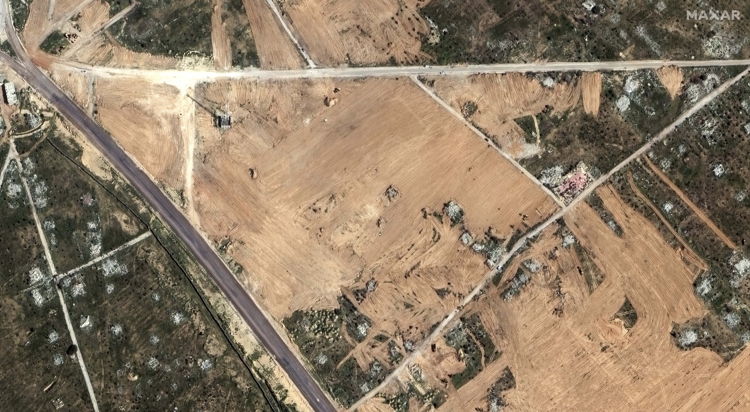 This satellite image provided by Maxar Technologies shows earth grading activity during buffer zone construction in Rafah, Egypt, Saturday, Feb. 10, 2024. (Maxar Technologies via AP)
