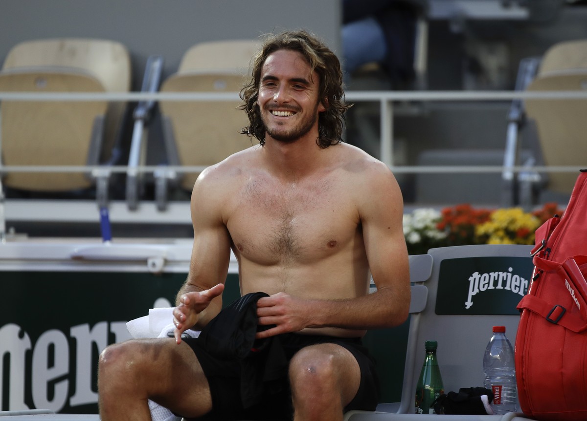 Greece's Stefanos Tsitsipas celebrates winning his quarterfinal match of the French Open tennis tournament against Russia's Andrey Rublev in three sets, 7-5, 6-2, 6-3, at the Roland Garros s ...