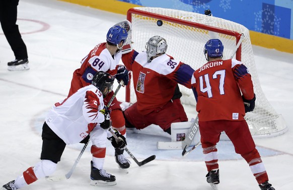 Andrew Ebbett (19), of Canada, shoots the puck past goalie Pavel Francouz (33), of the Czech Republic, for a goal during the third period of the men&#039;s bronze medal hockey game at the 2018 Winter  ...