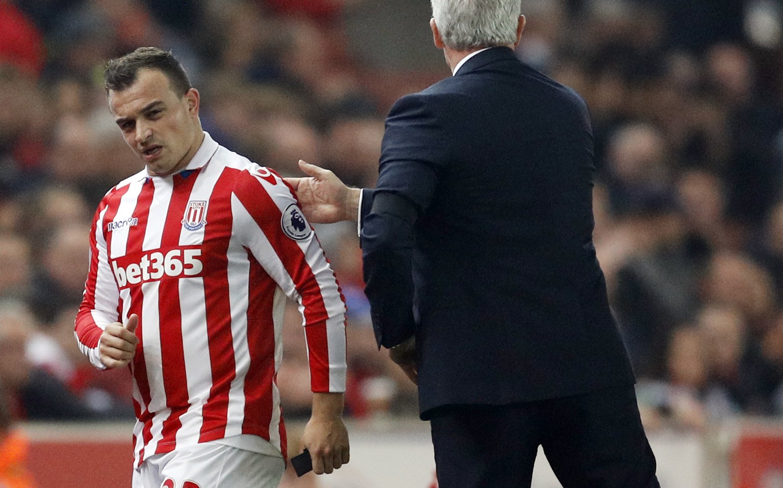 Britain Football Soccer - Stoke City v Swansea City - Premier League - bet365 Stadium - 31/10/16
Stoke City&#039;s Xherdan Shaqiri with Stoke City manager Mark Hughes after going off injured 
Reuter ...