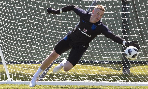 epa06806443 England goalkeeper Jordan Pickford performs during his team&#039;s training session in Zelenogorsk, Russia 14 June 2018. England prepares for the FIFA World Cup 2018 taking place in Russia ...