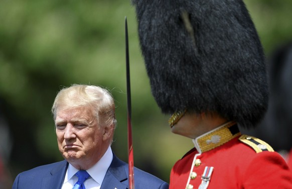 U.S. President Donald Trump inspects an honour guard during a welcome ceremony in the garden of Buckingham Palace, in London, for President Donald Trump and first lady Melania Trump Monday, June 3, 20 ...