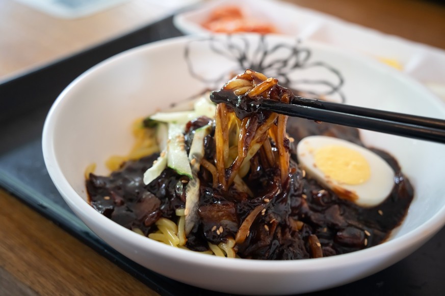 Delicious Jajangmyeon, jjajangmyeon, fried sauce noodle, Korean style Chinese noodle dish, topped with thick black bean paste sauce in South Korea.  Model released property released xkwx Jajangmyeon kor...