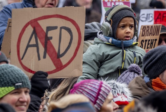 People gather as they protest against the AfD party and right-wing extremism in Frankfurt/Main, Germany, Saturday, Jan. 20, 2024. (AP Photo/Michael Probst)