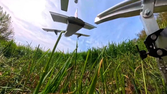 In this image made from video provided by Russian Defense Ministry Press Service on Wednesday, May 20, 2026, Russian servicemen launch an interceptor drone for an action in an undisclosed location in  ...