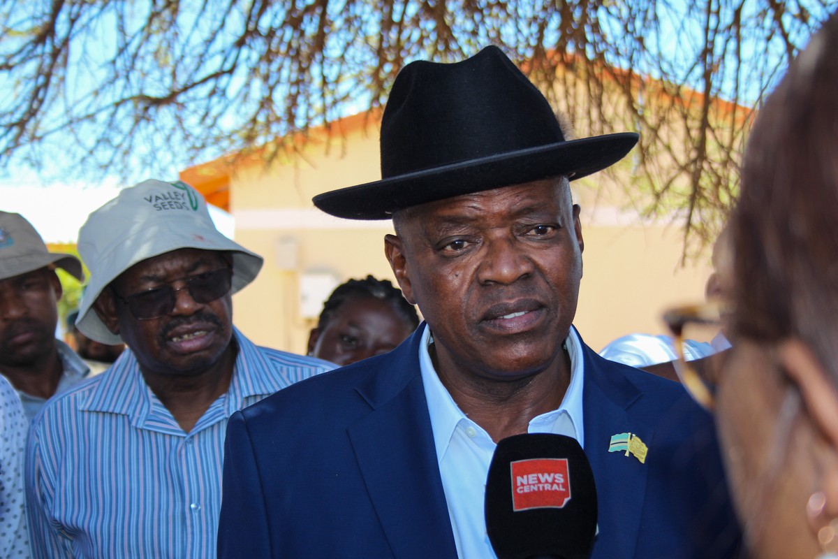 epa11692635 President of Botswana and presidential candidate for Botswana Democratic Party (BDP) Mokgweetsi Masisi (R) talks to media at Mosielele Primary School polling station in Moshupa Village, we ...