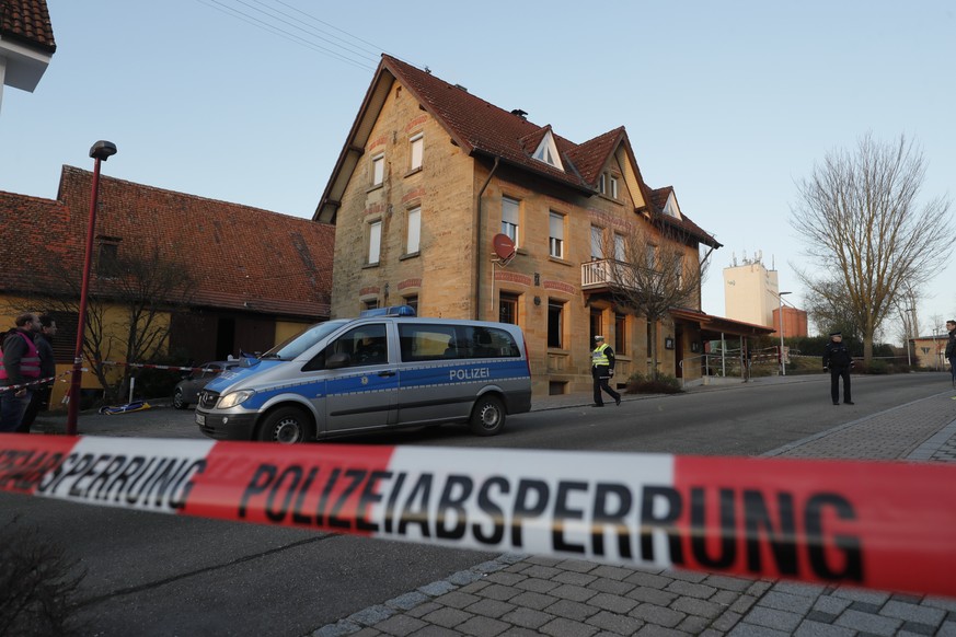 epa08159757 Police secure the crime scene after a shooting in Rot am See, Germany, 24 January 2020. According to a police report a shooting caused several injured and possible fatalities. One suspect  ...