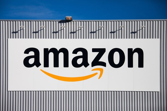 The Amazon logo is seen on the new logistics center of online merchant Amazon in Lauwin-Planque, northern France, Thursday, Sept. 19, 2013. Amazon France plans to create 2500 jobs by 2015 in this cent ...