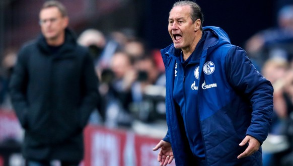 epa07442459 Schalke&#039;s interims head coach Huub Stevens (R) reacts during the German Bundesliga soccer match between FC Schalke 04 and RB Leipzig in Gelsenkirchen, Germany, 16 March 2019. EPA/FRIE ...