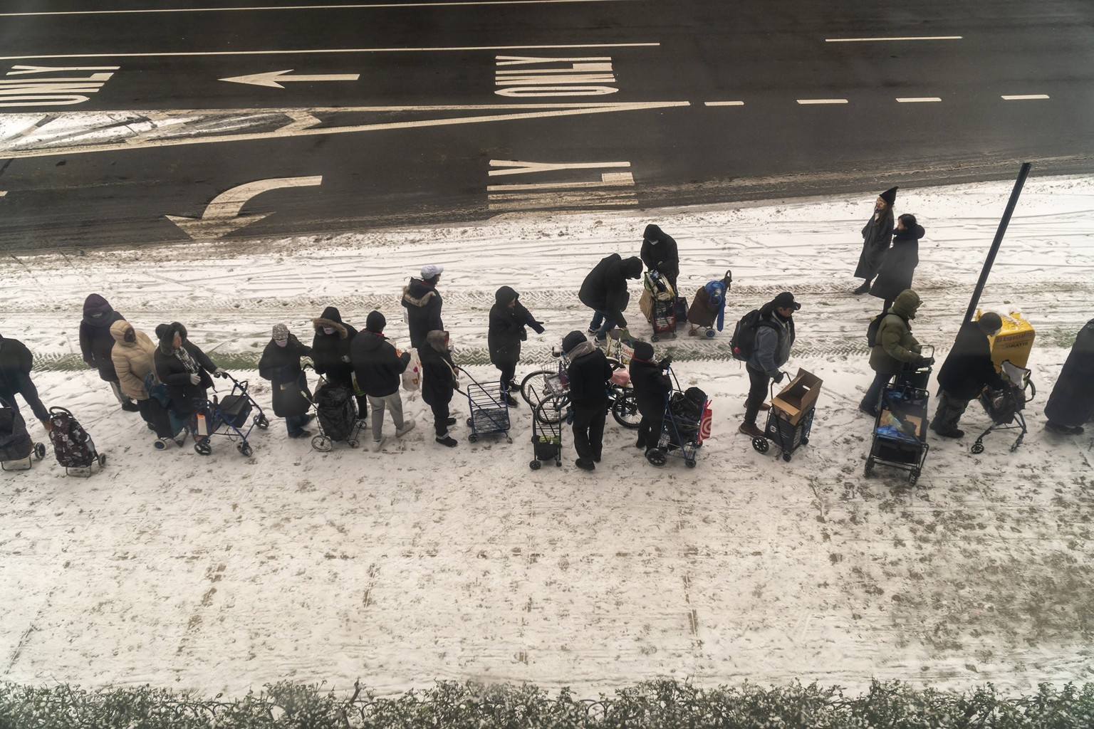 Clothing giveaway in New York on Christmas Eve Clients line up for cold weather clothing, blankets and other accoutrements given to the homeless and poor in front of the Church of the Holy Apostles in ...