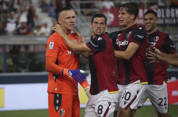 Bologna&#039;s goalkeeper Lukasz Skorupski and Bologna&#039;s Remo Freuler celebrates after saving a penalty during the Serie A soccer match between Bologna FC and Udinese at the Dall&#039;Ara Stadium ...
