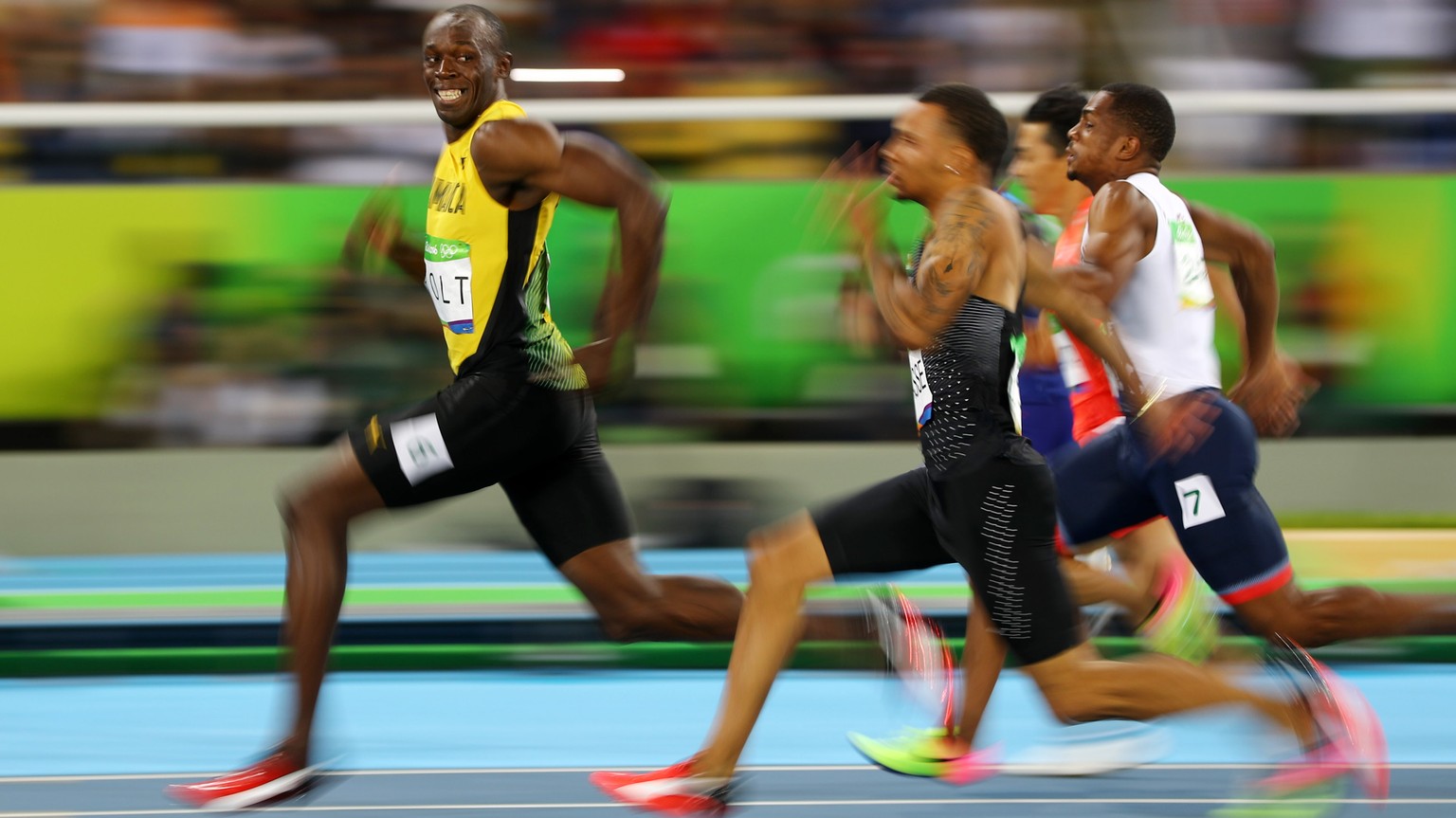 2016 Rio Olympics - Athletics - Semifinal - Men's 100m Semifinals - Olympic Stadium - Rio de Janeiro, Brazil - 14/08/2016. Usain Bolt (JAM) of Jamaica looks at Andre De Grasse (CAN) of Canada as they  ...