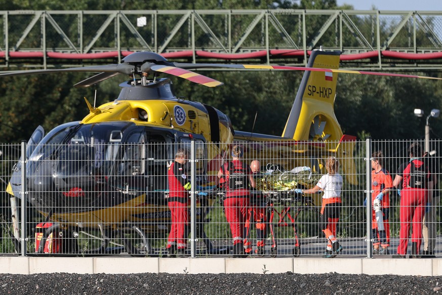 epa11476411 An injured miner is shifted to an Air Ambulance Helicopter to be transported to the hospital from the Rydultowy mine in Silesia, south Poland, 13 July 2024. The last of the miners sought i ...