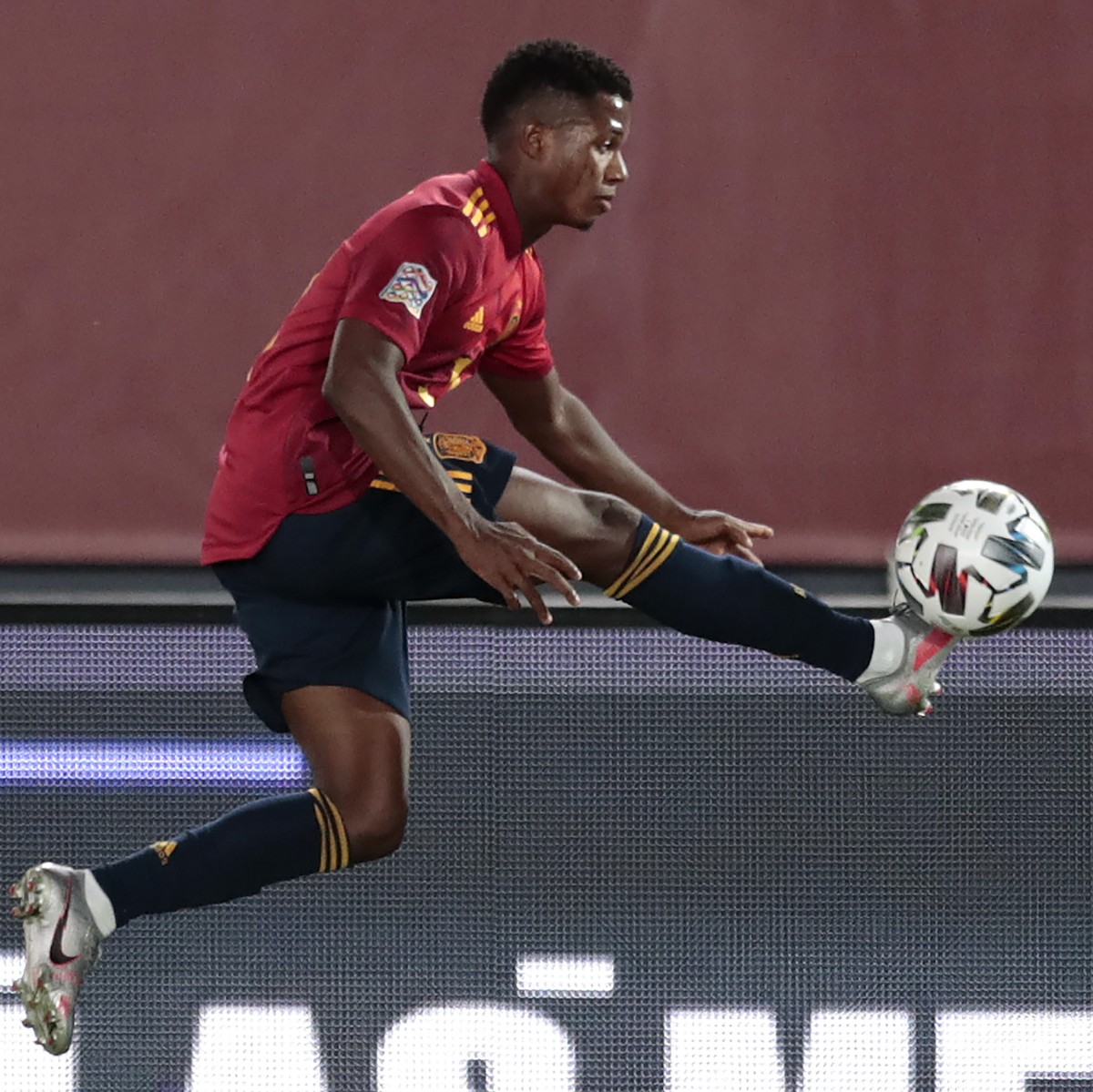 Spain's Ansu Fati is airborne as he attempts to control the ball during the UEFA Nations League soccer match between Spain and Ukraine at the Estadio Alfredo Di Stefano stadium in Madrid, Spain,  ...
