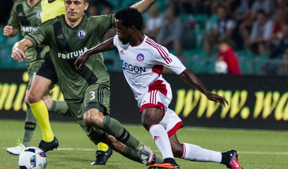 epa05444048 Rabiu Ibrahim (R) of AS Trencin in action against Tomasz Jodlowiec (L) of Legia Warszawa during the UEFA Champions League third qualifying round first leg soccer match between AS Trencin a ...