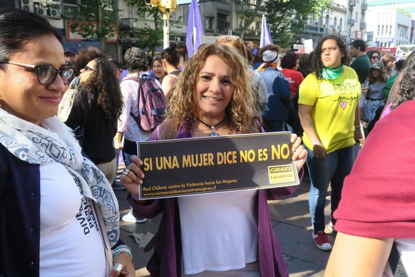 epa06351117 A woman holds a sign that reads &#039;If a woman says no it&#039;s no&#039; during a march called by the 14th Latin American and Caribbean Feminist Encounter in Montevideo, Uruguay, 25 Nov ...