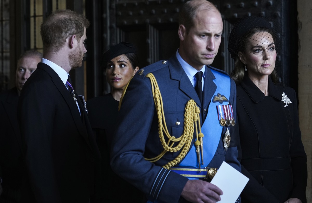 Britain's Prince William, second right, Kate, Princess of Wales, right, Prince Harry, left, and Meghan, Duchess of Sussex, second left, leave after they paid their respects to Queen Elizabeth II  ...