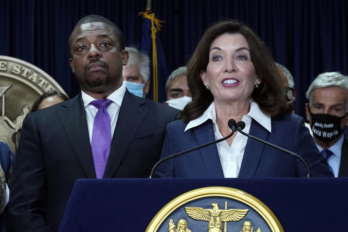 FILE �?? New York Gov. Kathy Hochul, accompanied by Lt. Gov. Brian Benjamin, left, speaks during ceremonies in the governor's office, in New York, Sept. 17, 2021. Benjamin, whose seven months in  ...