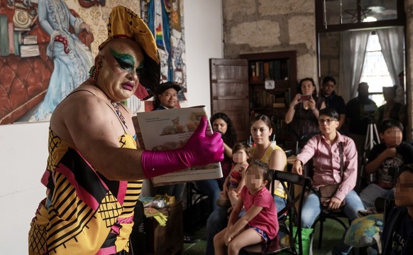 epa10601278 A member of the collective LGBTI Citizen Council of Monterrey &#039;Cuenti Drag&#039; participates in Children&#039;s Day celebrations by telling stories to chuildren, in the Antiguo neigh ...