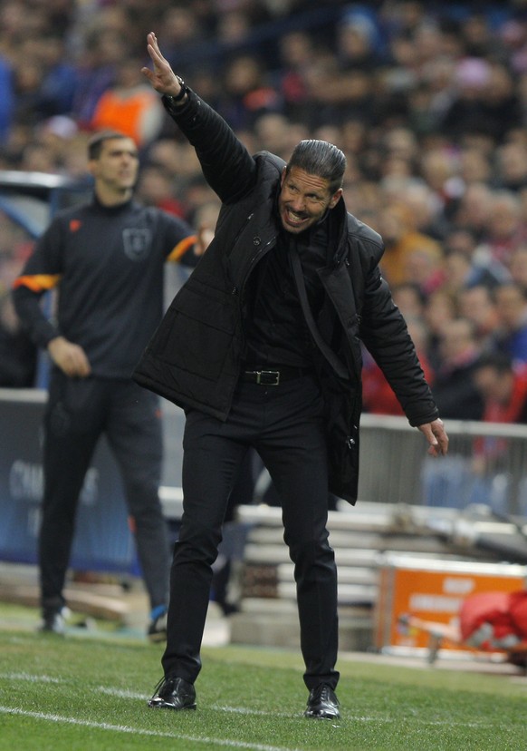 Atletico&#039;s coach Diego Simeone reacts during the Champions League round of sixteen second leg soccer match between Atletico de Madrid and Bayer 04 Leverkusen at the Vicente Calderon stadium in Ma ...