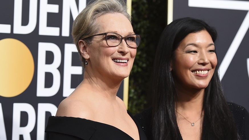 Meryl Streep, left, and Ai-jen Poo arrive at the 75th annual Golden Globe Awards at the Beverly Hilton Hotel on Sunday, Jan. 7, 2018, in Beverly Hills, Calif. (Photo by Jordan Strauss/Invision/AP)