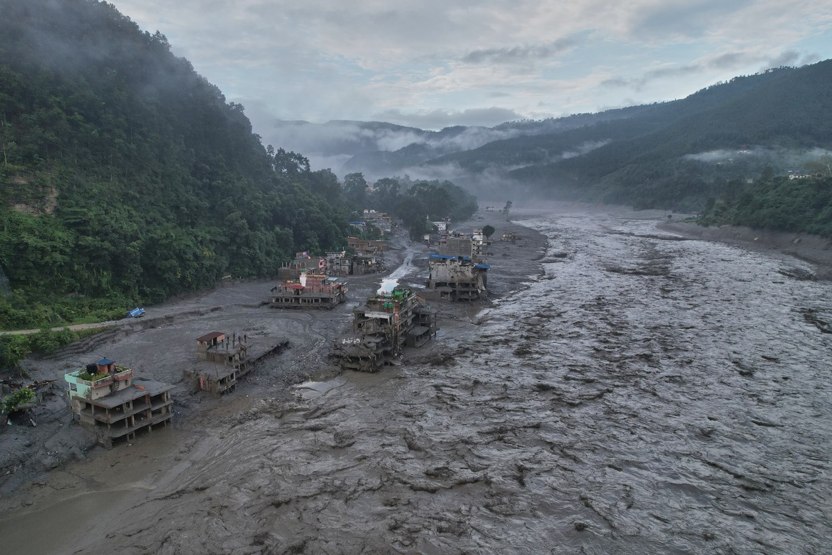 A drone view of the aftermath of flash flooding along the Trishuli river amidst fresh water surge warning in the Trishuli Bazaar area of Nuwakot district, Nepal, Sunday, Aug. 30, 2026. (AP Photo/Rajes ...