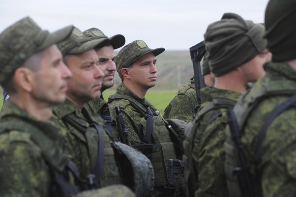 Recruits listen to an instructor during military training at a firing range in southern Russia's Rostov-on-Don region, Tuesday, October 1.  December 4, 2022. Russian Defense Minister Sergei Shoigu said that the…