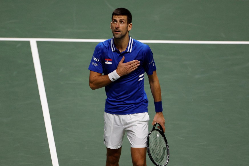 epa09619617 Novak Djokovic of Serbia celebrates winning against Marin Cilic of Croatia during their semi final Davis Cup tie between Serbia and Croatia held at Madrid Arena tennis complex in Madrid, c ...