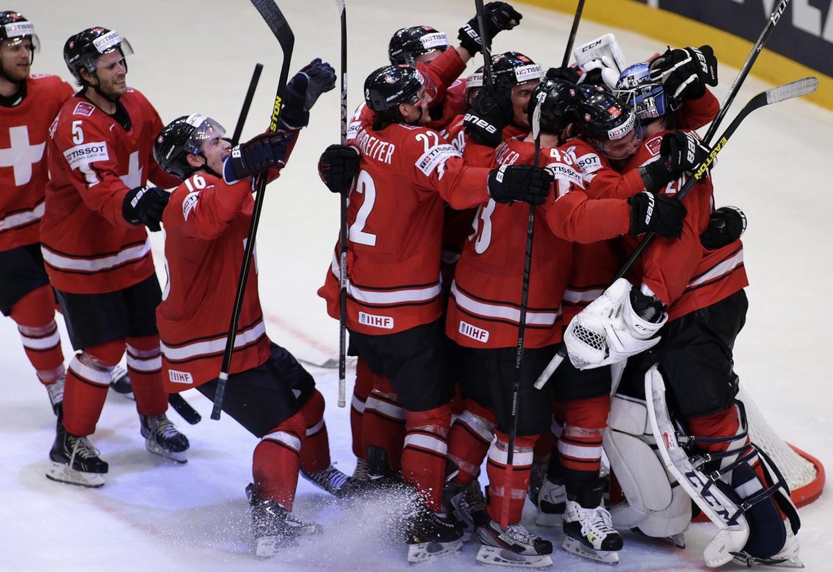 Switzerland's players celebrate their victory over USA, during the IIHF Ice Hockey World Championships semifinal match Switzerland vs USA at the Globe Arena in Stockholm, Sweden, on Saturday, 18  ...