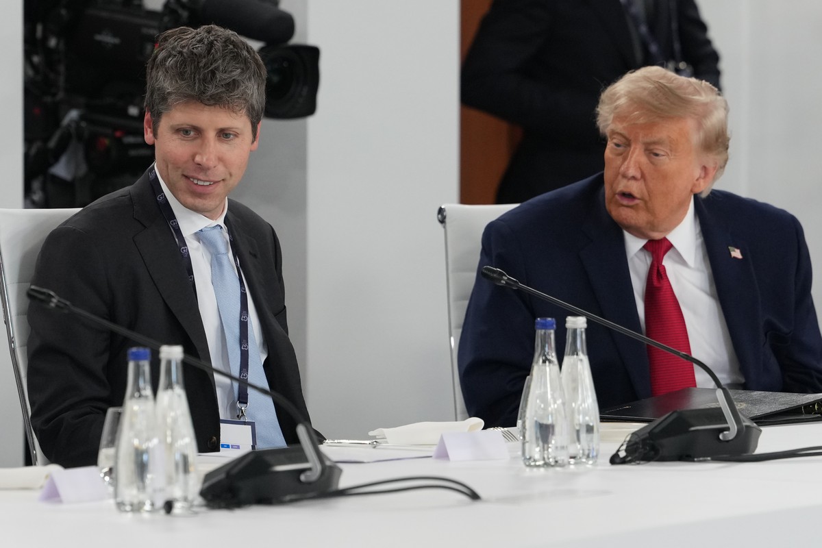 U.S. President Donald Trump talks to CEO of OpenAI Sam Altman as they participate in a meeting with leaders during the G7 summit, Wednesday, June 17, 2026, in Evian-les-Bains, France. (AP Photo/Julia  ...