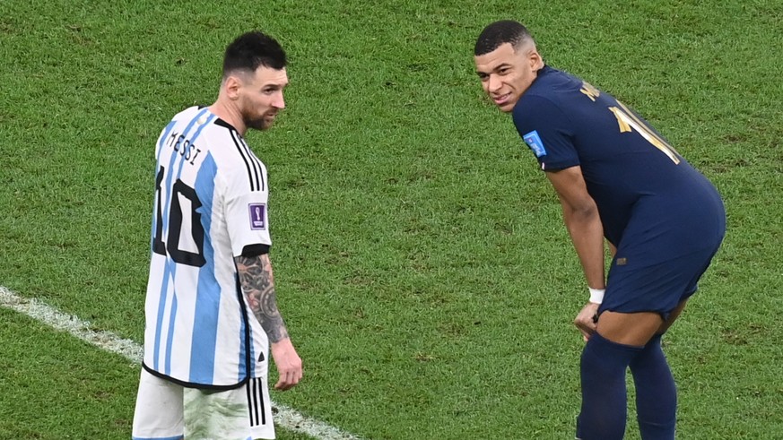 epa10372695 Lionel Messi (L) of Argentina and Kylian Mbappe of France react during the FIFA World Cup 2022 Final between Argentina and France at Lusail stadium, Lusail, Qatar, 18 December 2022. EPA/Ge ...