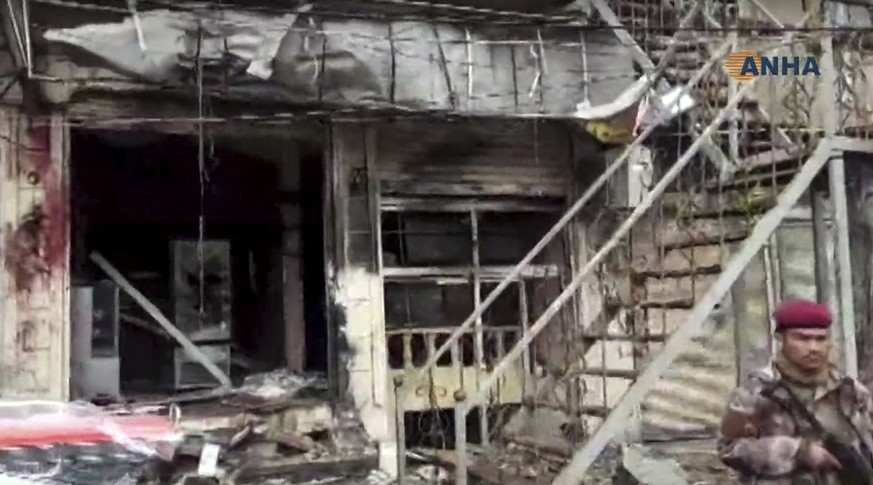 This frame grab from video provided by Hawar News, ANHA, the news agency for the semi-autonomous Kurdish areas in Syria, shows a damaged restaurant where an explosion occurred, in Manbij, Syria, Wedne ...