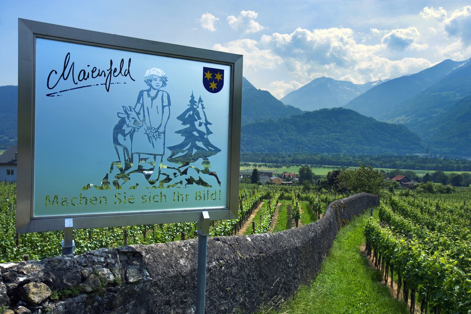A sign in Maienfeld, Switzerland, refers to the world-famous Heidi story by Johanna Spyri that is set in this region in the Grisons, pictured on May 30, 2005. In Heididorf above Maienfeld, visitors fr ...
