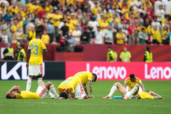 Colombian players lie dejected after losing penalty shootout during the World Cup round of 16 soccer match between Switzerland and Colombia in Vancouver, British Columbia, Tuesday, July 7, 2026. (AP P ...