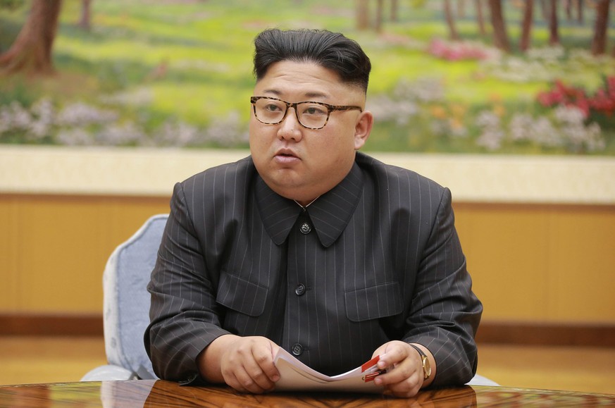In this Sept. 3, 2017, image distributed on Monday, Sept. 4, 2017, by the North Korean government, North Korea's leader Kim Jong Un holds a meeting of the ruling party's presidium. North Korea claimed ...