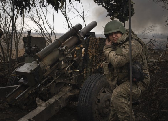 FILE - Ukrainian soldiers of the 71st Jaeger Brigade fire a M101 howitzer towards Russian positions at the frontline, near Avdiivka, Donetsk region, Ukraine, Friday, March 22, 2024. Ukraine?s parliame ...