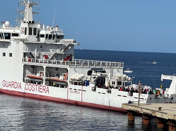 epa10747714 The Italian Coast Guard ship transports migrants from Lampedusa, Italy, 15 July 2023. Over eight hundred migrants were transferred two days ago. Another 316 migrants arrived in Lampedusa i ...