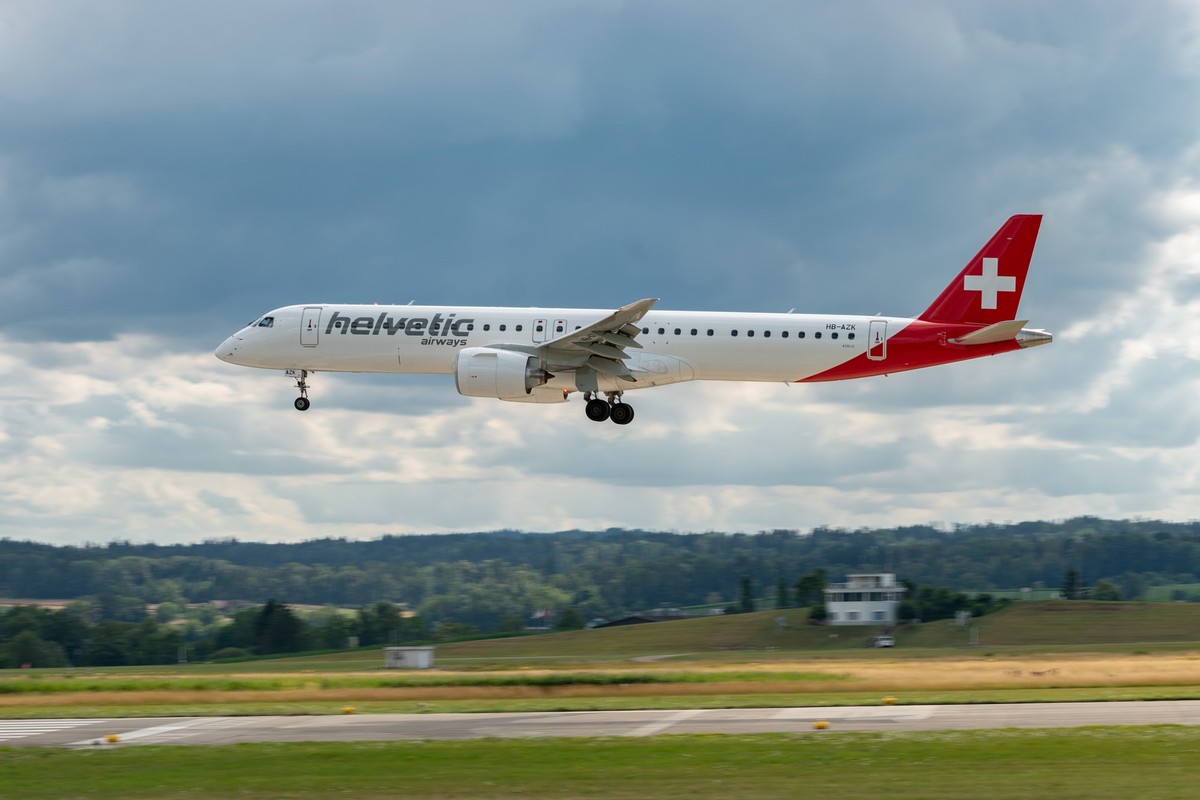 Zurich, Switzerland, July 13, 2023 HB-AZK Helvetic Airways Embraer E195-E2 aircraft is landing on runway 14 xkwx zurich switzerland airport international flight aircraft plane travel transportation sp ...