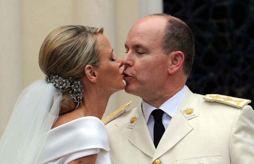 epa04232548 (FILE) A file picture dated 02 July 2011 shows Prince Albert II and Princess Charlene of Monaco kissing at the Saint Devote church after their religious wedding ceremony in Monaco. Accordi ...