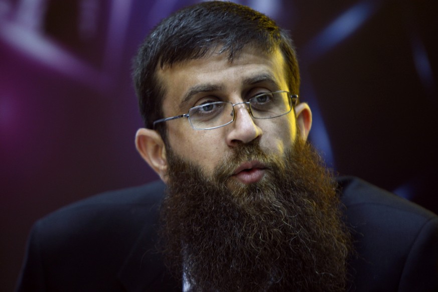 FILE - Palestinian Khader Adnan, an Islamic Jihad spokesman who went on a 66-day hunger strike while he was imprisoned in an Israeli jail, speaks during a television interview in the West Bank city of ...