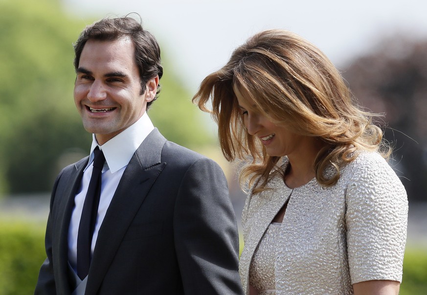 Swiss tennis player Roger Federer and his wife Mirka arrive at St Mark's Church in Englefield, England, ahead of the wedding of Pippa Middleton and James Matthews, Saturday, May 20, 2017. Middleton, t ...