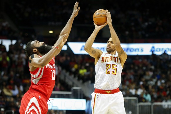 Nov 5, 2016; Atlanta, GA, USA; Atlanta Hawks forward Thabo Sefolosha (25) shoots the ball over Houston Rockets guard James Harden (13) in the third quarter at Philips Arena. The Hawks defeated the Roc ...