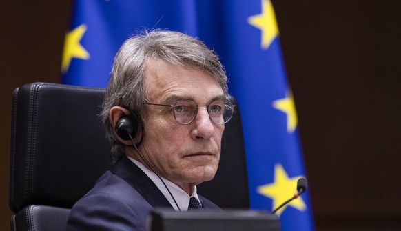 epa08886845 President of the European Parliament David Sassoli listens to a speech of President of the EU Commission on the conclusions of Rule of Law Conditionality and Own Resources, at European Par ...