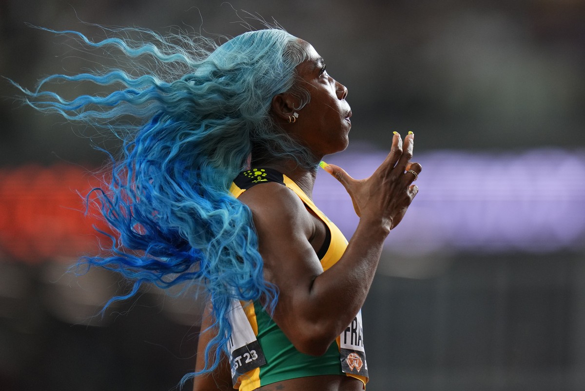 Shelly-Ann Fraser-Pryce, of Jamaica anchors her team to win a Women's 4x100-meters relay heat during the World Athletics Championships in Budapest, Hungary, Friday, Aug. 25, 2023. (AP Photo/Petr  ...
