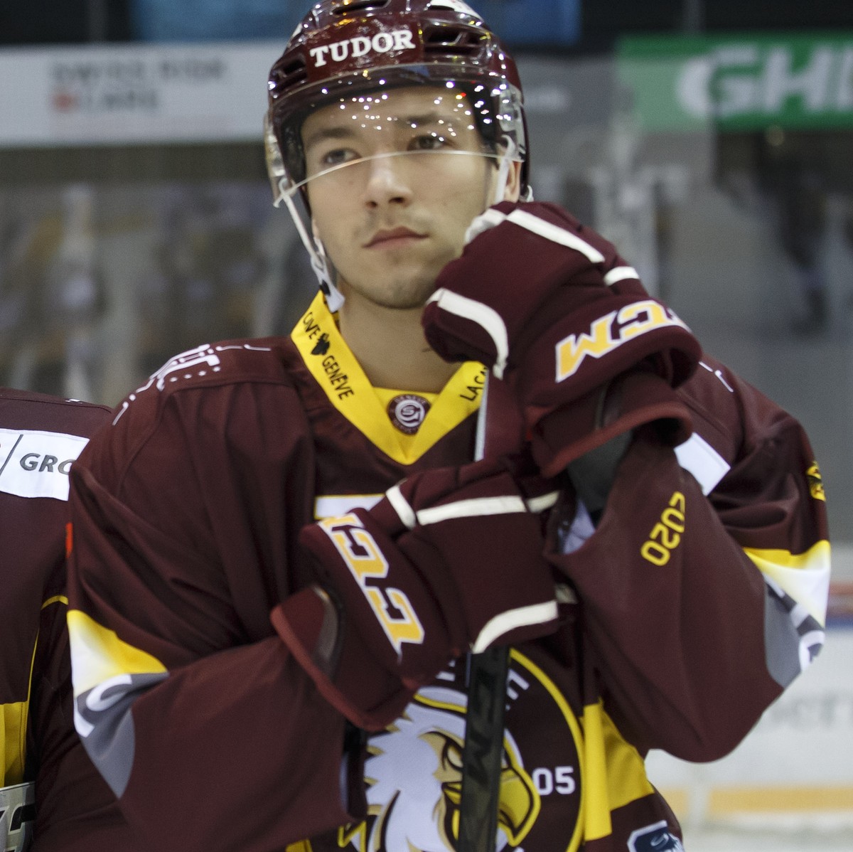 Geneve-Servette's players defender Arnaud Jacquemet, left, goaltender Robert Mayer, center, and Geneve-Servette's defender Petr Cajka, of Czech Republic, right, look disappointed after losin ...