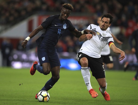 England's Tammy Abraham, left, and Germany's Mats Hummels battle for the ball during the international friendly soccer match between England and Germany at Wembley stadium in London, Britain, Friday,  ...