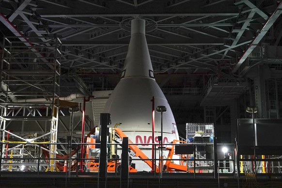 A section of the Artemis rocket with the Orion space capsule is seen inside the Vehicle Assembly Building at the Kennedy Space Center, Friday, Nov. 5, 2021, in Cape Canaveral, Fla. Artemis will launch ...