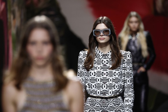 epa10896813 A model presents a creation from the Spring/Summer 2024 Womenswear collection by French designer Virginie Viard for Chanel fashion house during the Paris Fashion Week, in Paris, France, 03 ...