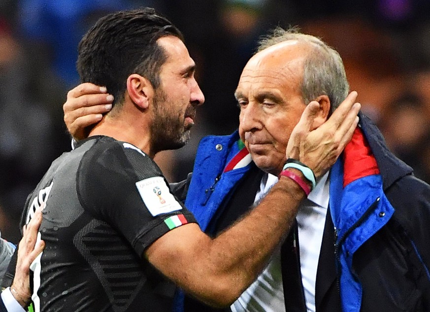 epaselect epa06327491 Italy&#039;s goalkeeper Gianluigi Buffon (L) and head coach Gian Piero Ventura (R) show their dejection after the FIFA World Cup 2018 qualification playoff, second leg soccer mat ...